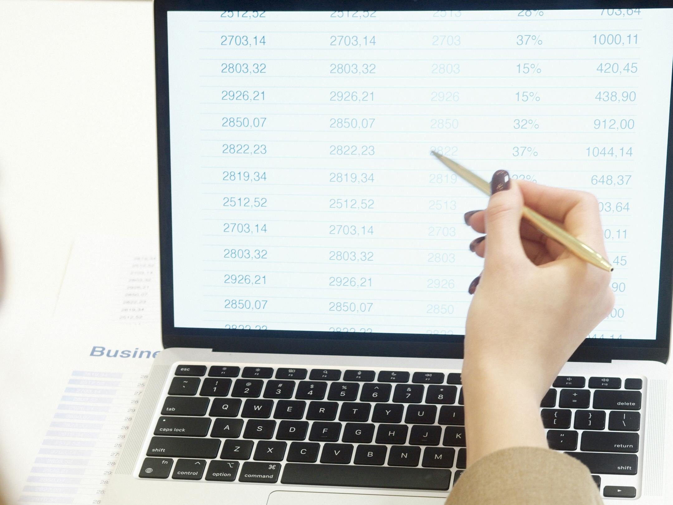 Business professional analyzing financial data on a laptop for strategic decision making.